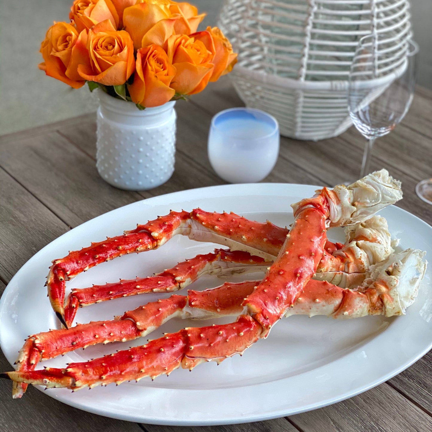 Butterfly split wild Alaskan red king crab legs plated with lemon and herbs