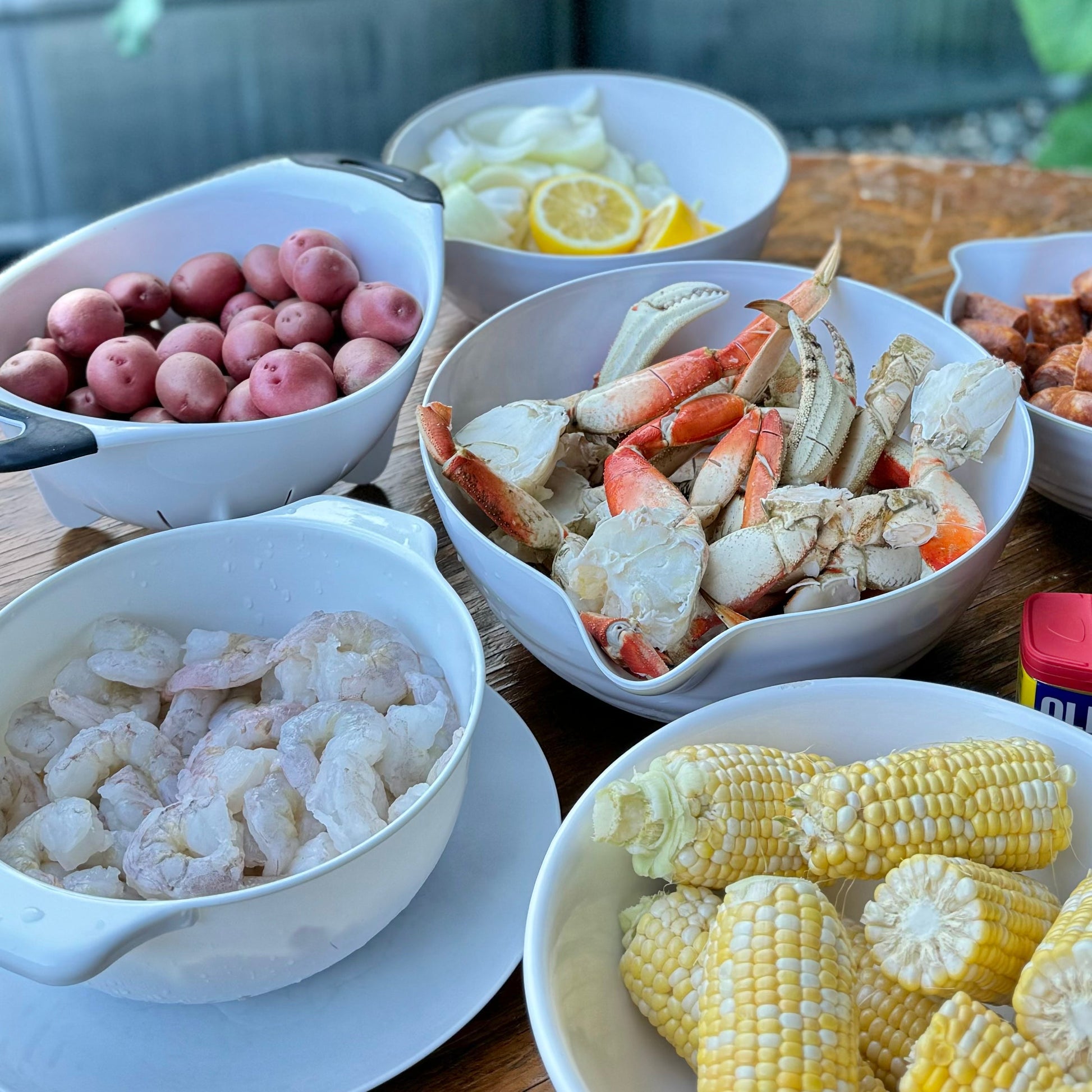 Wild Dungeness crab and wild shrimp seafood boil bundle with corn, potatoes, and lemon.
