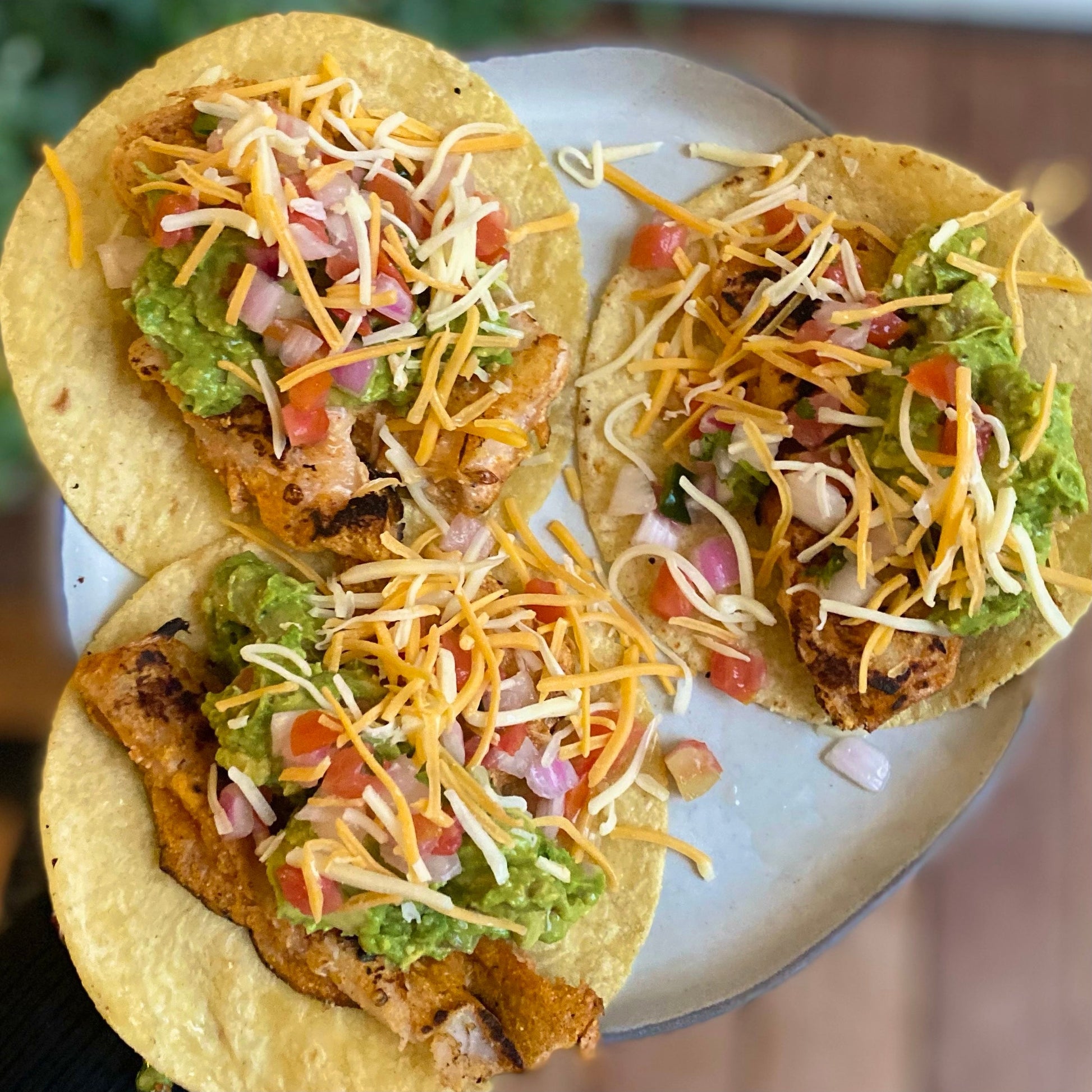 Wild Alaska cod fish tacos topped with cabbage, herbs, and sauce.