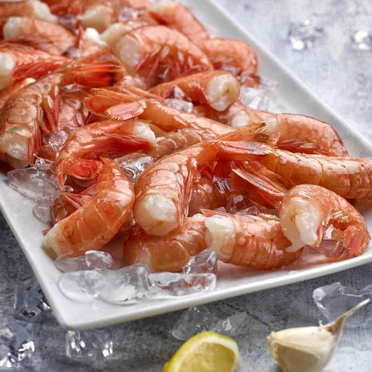 Wild Alaskan spot prawns on ice with lemon and garlic
