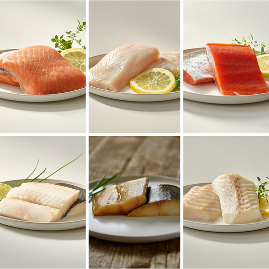king salmon, sockeye salmon, halibut, cod, and black cod on plates