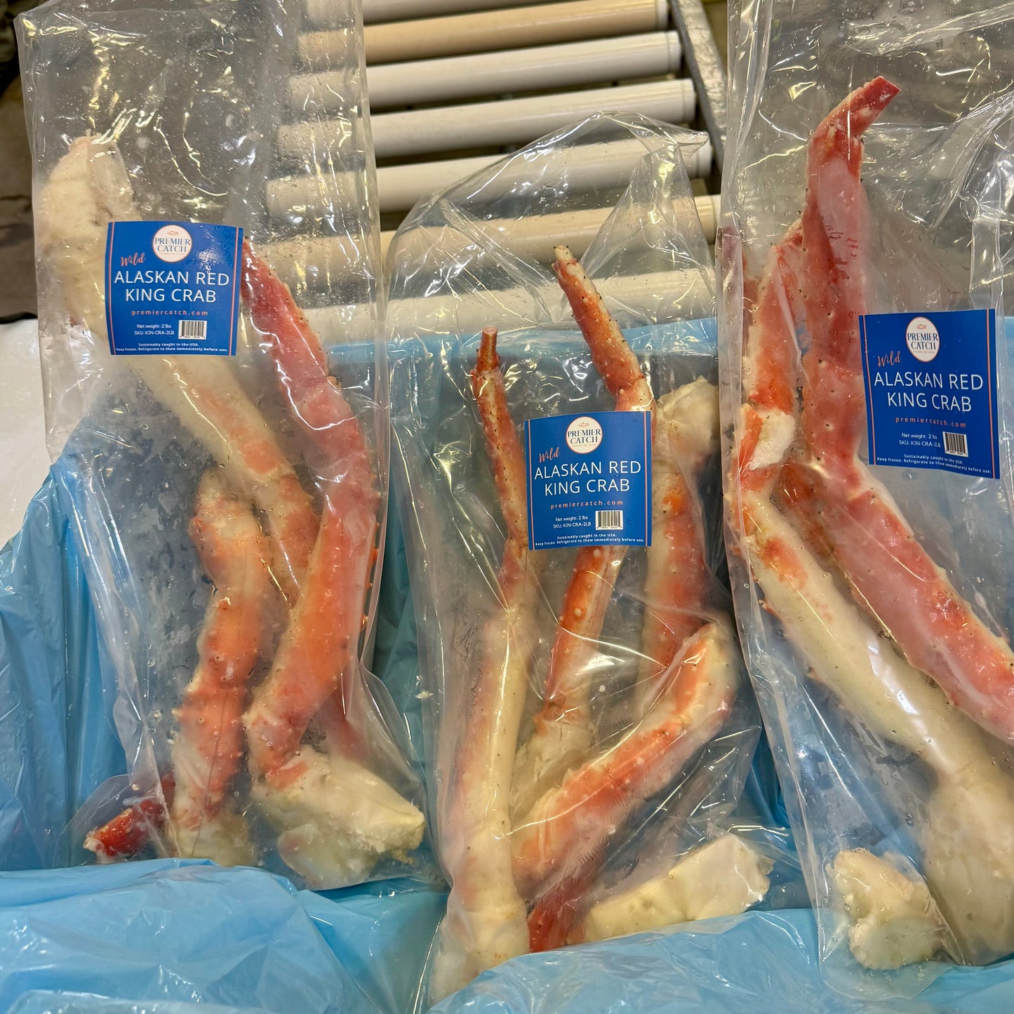 Premier Catch butterfly split wild Alaskan red king crab legs in retail packaging